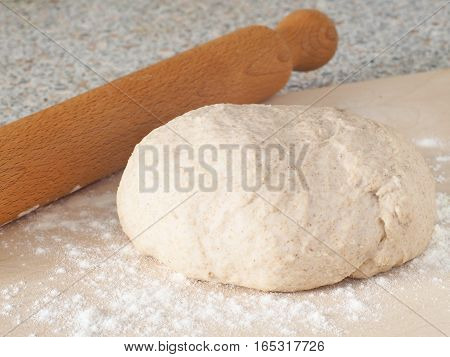 Cooking process. Preparing fresh dough for cakes, pastries, buns or pizza. Ball of homemade wholegrain dough.