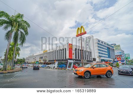 Bandar Seri Begawan,Brunei-Nov 11,2016:View on the main street in Bandar Seri Begawan,Brunei with buildings and a walkway,cars on the road in the background.