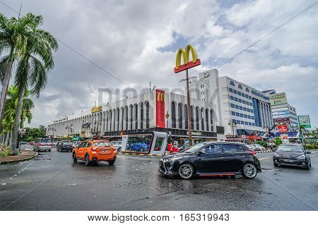 Bandar Seri Begawan,Brunei-Nov 11,2016:View on the main street in Bandar Seri Begawan,Brunei with buildings and a walkway,cars on the road in the background.