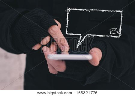 Male hands and mobile phone with text balloon as copy space man wearing woolen gloves for cold winter weather