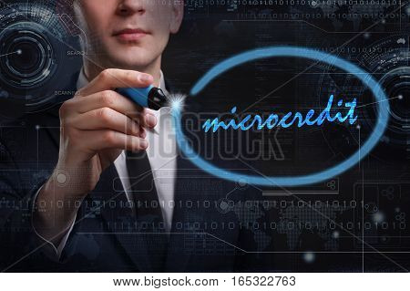 Business, Technology, Internet And Network Concept. Young Business Man Writing Word: Microcredit