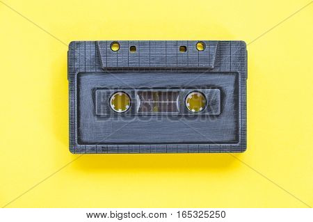 old vintage style cassette tape on a plain background