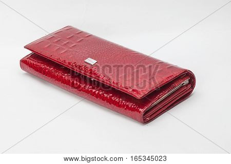Red varnished wallet on the white background