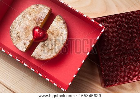 A cheese with a heart on the red box
