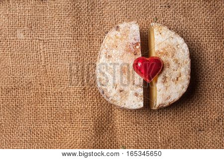 A cheese with a heart on a sackcloth