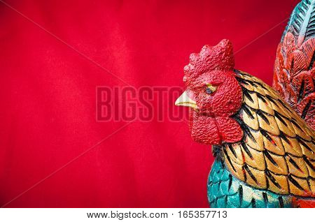 celebrate Chinese New Year background with chicken statue concept of the Year of the Rooster.