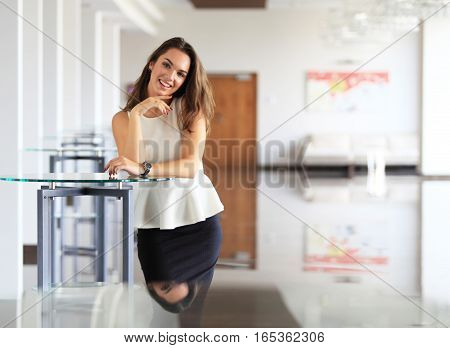 Modern business woman in the office with copy space