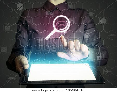 Image of a girl with tablet in her hands and search icon. Сoncept search engine optimization customer support.