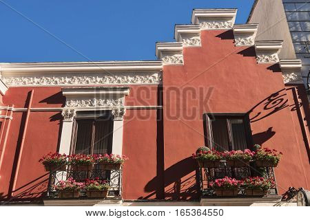 Leon (Castilla y Leon Spain): historic building in Calle San Pedro with balconies and flowers