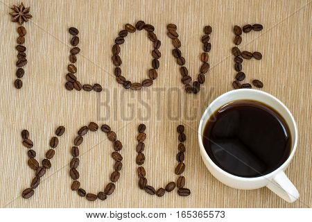 I love you sign with coffee beans and cup of coffee