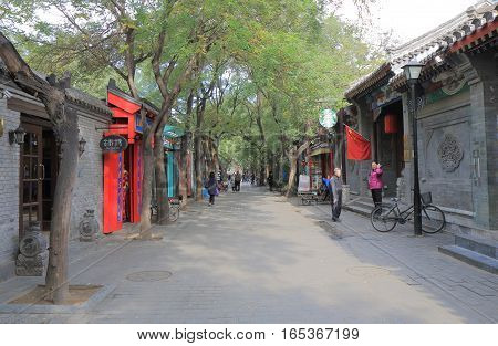 BEIJING CHINA - OCTOBER 29, 2016: Unidentified people visit Nanluoguxiang futong street. Nanluoguxiang lane has become a popular tourist destination with restaurants and bars.