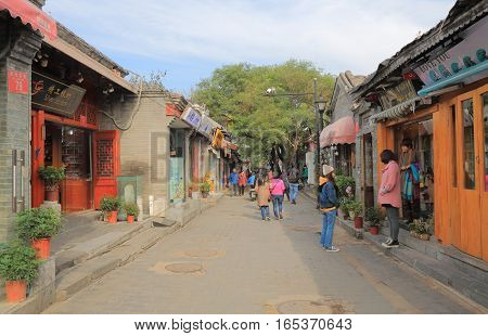 BEIJING CHINA - OCTOBER 29, 2016: Unidentified people visit Nanluoguxiang futong street. Nanluoguxiang lane has become a popular tourist destination with restaurants and bars.