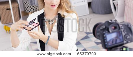 Blogger Showing Cosmetics
