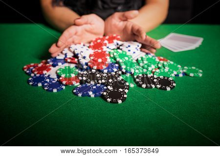 Poker player going all in on poker table