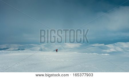 Two people away on a glacier snow desert extreme climbing