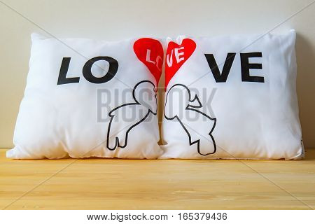 Pillow Love with Valentine's Day on wooden Background