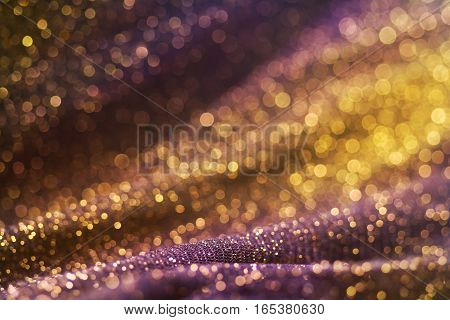 Amazing glitter and glow multi colored bokeh shining. Dark abstract dreamy wunderful sparkle background