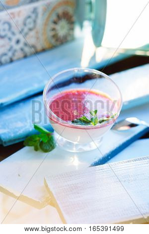 Tasty Panna Cotta over blue vintage backround