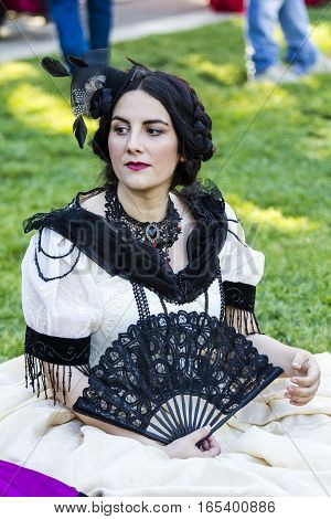 CAGLIARI, ITALY - May 29, 2016: Sunday at La Grande Jatte VIII Ed. At the Public Gardens - Sardinia - portrait of a beautiful girl in Victorian costumes