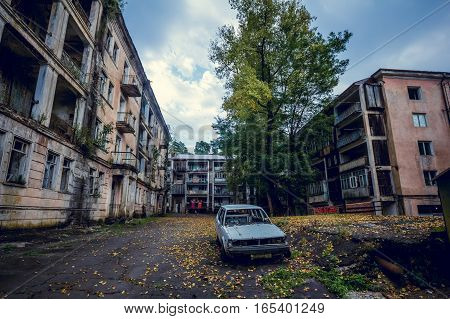 Abandoned mining ghost-town Jantuha, Abkhazia. Destroyed empty houses, the remains of the cars, remnant of The Georgian-Abkhazian war