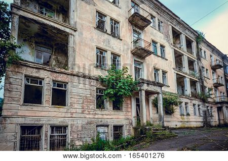 Abandoned mining ghost-town Jantuha, Abkhazia. Destroyed empty houses, the remains of the cars, remnant of The Georgian-Abkhazian war