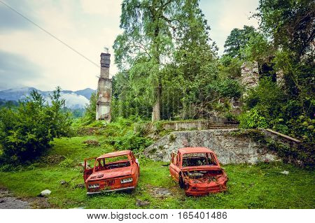 Abandoned mining ghost-town Jantuha, Abkhazia. Destroyed empty houses, the remains of the cars, remnant of The Georgian-Abkhazian war