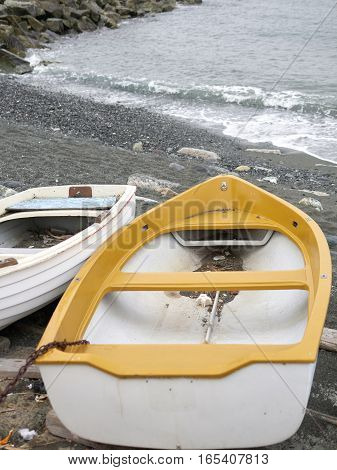 detail of same boats in a beach in arenzano