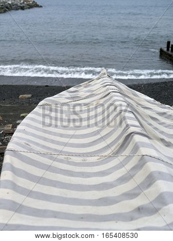 detail of same boats in a beach in arenzano