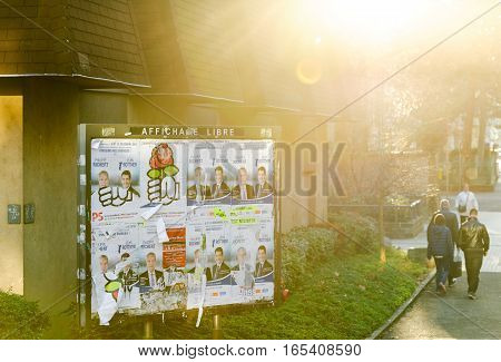 MULHOUSE FRANCE - DEC 19 2015: Political advertising banner with portraits of French politicians and elections posters of candidates
