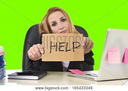 frustrated business woman in her 40s holding help sign desperate suffering stress overworked working at office laptop computer in sad worried face expression isolated green chroma key screen