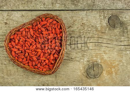 Goji Berries On The Wooden Table. Traditional Chinese Superfood. Healthy Diet Rich In Minerals And V