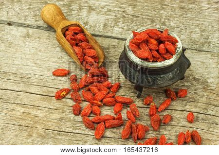 Goji Berries On The Wooden Table. Traditional Chinese Superfood. Healthy Diet Rich In Minerals And V