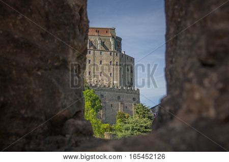 Italy Piedmont - May 9 2015: view of Saint Michael's Abbey in Val di Susa from San Sepolcro ruins window on May 9 2015 in Piedmont Italy.