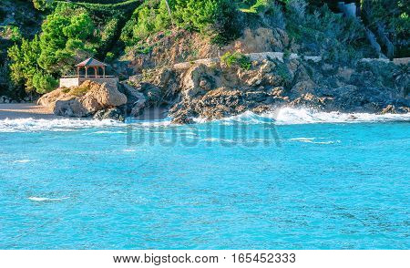 Spain. Catalonia. Costa Brava. Beach Sa Riera. Beautiful views of the Mediterranean coast. Tourist places. The picturesque promenade along the sea.