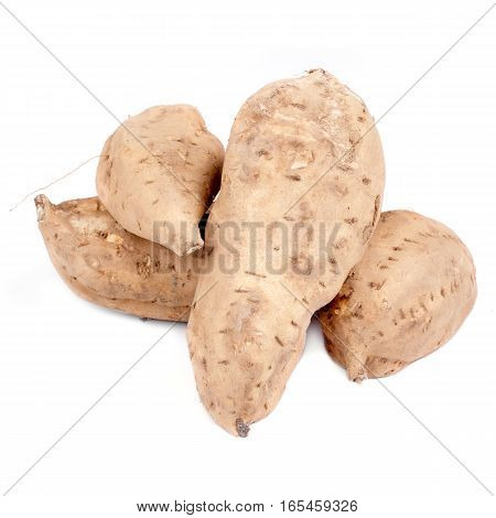 Some sweet potatoes isolated on white background.