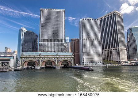 Office buildings of southern Manhattan with Governor's Island ferry docking.
