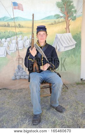 JULY 24, 2015. CASPER, WYOMING. CIRCA: Young calvary reenactor military male recruit posing for the camera outdoors at the annual pioneer day in Casper.