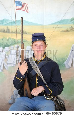 JULY 24, 2015. CASPER, WYOMING. CIRCA: Young calvary reenactor military male recruit posing for the camera outdoors at the annual pioneer day in Casper.