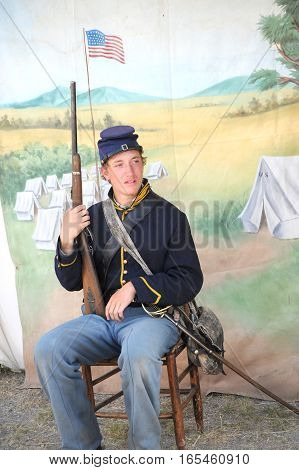 JULY 24, 2015. CASPER, WYOMING. CIRCA: Young calvary reenactor military male recruit posing for the camera outdoors at the annual pioneer day in Casper.