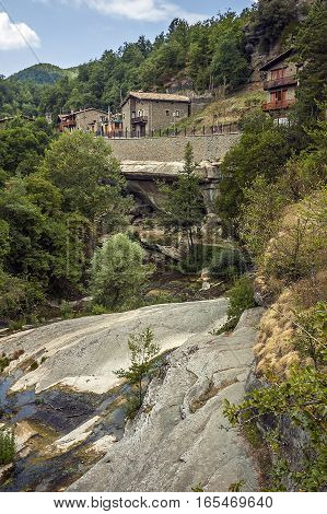 Spain Catalonia . Rupit - mountain village built on top of the basalt rocks in the national park of volcanic origin at an altitude of nine hundred meters above sea level .