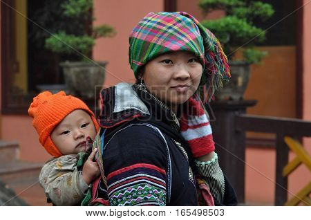 Vietnamese Hmong Woman Carrying Her Child
