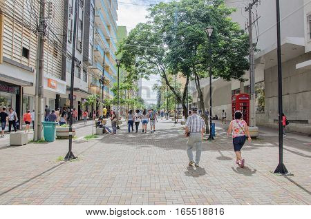 Londrina PR Brazil - December 23 2016: Downtown of Londrina. People walking between the downtown shops. Street called Calcadao destined to commerce and leisure.