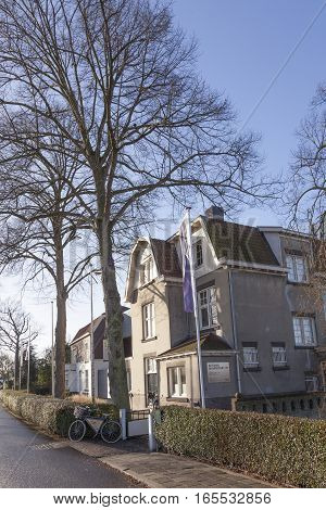 Leerdam, Netherlands, 4 january 2017: glass museum and bicycle in dutch town of Leerdam in the Netherlands
