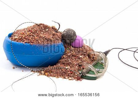 Dry Feed For Carp Fishing. Ready For Use Carp Bait With Fishing Flat Feeder For Carp Fishing Isolate