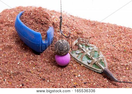 Dry Feed For Carp Fishing As Background. Ready For Use Carp Bait With Fishing Flat Feeder For Carp F