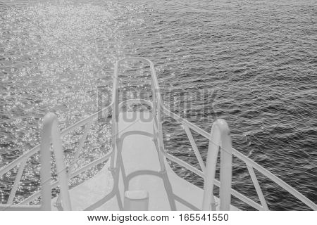 white black beautiful yacht bow on water surface background