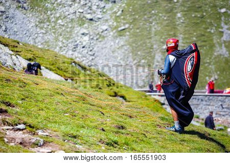 Balea Lake, Romania - July 21, 2014: Unidentified Paraglider In Balea Lake, Fagaras Mountain, Romani