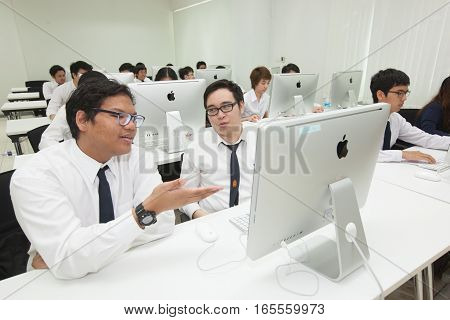 Bangkok, Thailand - November 17, 2015 : 
King Mongkut's Institute of Technology Ladkrabang is a research and educational institution in Thailand.
A class of students in front of their screens study computer science.