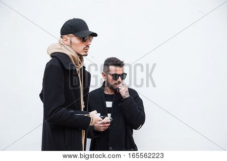 MILAN ITALY - JANUARY 15: Fashionable people gather outside Damir Doma fashion show building during Milan Men's Fashion Week on JANUARY 15 2017 in Milan.
