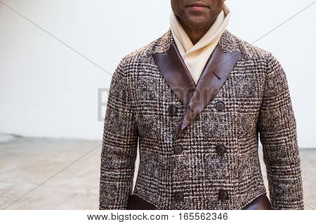 MILAN ITALY - JANUARY 15: Fashionable man poses outside Damir Doma fashion show building during Milan Men's Fashion Week on JANUARY 15 2017 in Milan.
